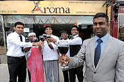 cheers: Manager Cholan Dharumalingam with staff at Aroma in Gloucester